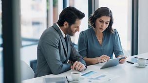 Business people, teamwork and tablet for statistics, finance report and planning of revenue, profit or sales in office. Professional advisor or clients with data analytics, graphs and digital charts