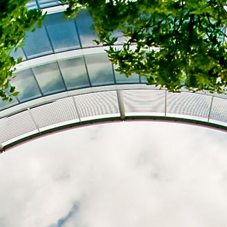 Upward view of office building from patio