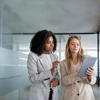Modern office building or business center. High-rise windor buildings made of glass reflect the clouds and the sunlight. empty street outside  wall modernity civilization. growing up business