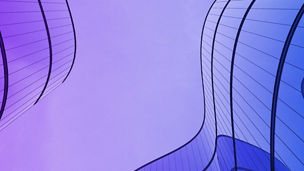 Purple sky and office buildings with curved glass windows