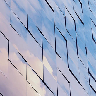 View of the clouds reflected in the glass office building. 3d rendering