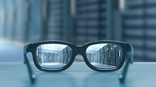 Night cityscape focused in glasses lenses. Vision concept