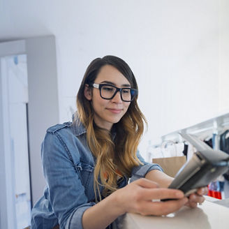 Woman customer paying by credit card in a retail setting