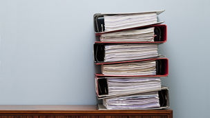Ring binders on cabinet. Keywords: Document, Ring Binder, Paper, Stack, Organisation, Paperwork, Order, Cupboard, No People, Photography, Colour Image, Abundance, Germany, Day, Copy Space, Horizontal, Indoors, Still Life 