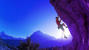 Man climbing a challenging rock