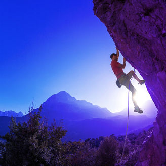 Man climbing a challenging rock