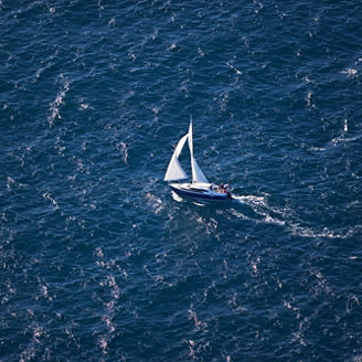 Sailboat. Keywords: Sailing Boat, Aerial View, Sea, Elevated View, Sail, Wind, Nautical Vessel, Speed, Ship, Travel, Water, Global Business, Colour Image, Copy Space, Day, Enjoyment, Florida - US State, Fun, Global, Group of Objects, Horizontal, Journey, Miami, Mode of Transport, No People, North America, Outdoors, Passenger Ship, Photography, Rippled, Sailing Ship, The Americas, Transportation, USA 