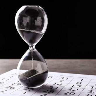 hourglass on a sheet of music