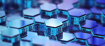 Close-up of a pattern of raised hexagonal tiles with translucent edges, illuminated in shades of blue and purple