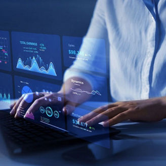 Hands typing on a laptop