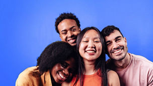 A portrait of a group of diverse friends against a bright blue background