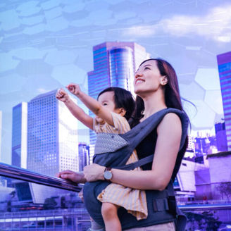 Asian mother and baby looking up hopefully