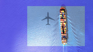 Ship in sea and shadow of plane