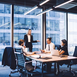 Professional financial experts collaborating during brainstorming meeting listening information from clever female director, businesswoman providing information to corporate workers of company