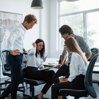 With documents. Young business people in formal clothes working in the office.