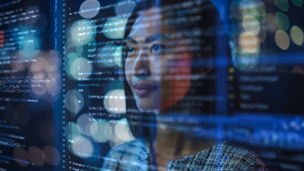 Portrait of Asian Female Startup Digital Entrepreneur Working on Computer, Line of Code Projected on Her Face and Reflecting. Software Developer Working on e-Commerce AI App, Big Data Concept.