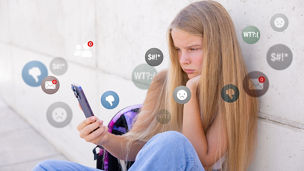 Sad girl viewing negative reactions and comments on social media, concept of children online bullying.