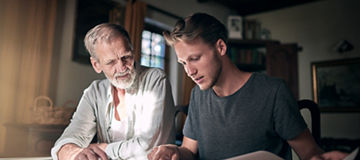 Architect, father and man planning blueprint together for collaboration, studying and research in home. Senior person, student and documents in house for drawing, education and design paperwork; Shutterstock ID 2469536079; purchase_order: 
