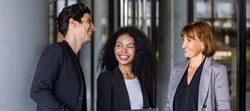 Team of diversity business people are discussing over the new strategic strategy project on investment real estate while walking around the office building for new project and planning