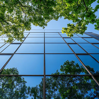 Sustainble green building Ecofriendly building Sustainable glass office building with tree for reducing carbon dioxide Office with green environment Corporate building reduce CO2 Safet; Shutterstock ID 2559315729; purchase_order: 