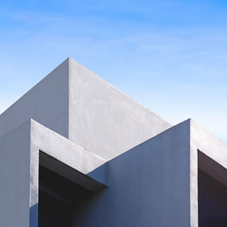 Office Building with Abstract Concrete Wall in Modern Geometric Triangle Shape Design and Angle Roof against Blue Sky Vertical Background, Exterior Architecture Backdrop in Minimal Style