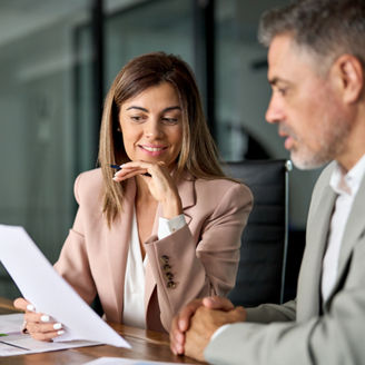 Legal consultancy concept. Business woman lawyer attorney showing document to man client providing advisory services, professionals discussing tax papers working in office at meeting.