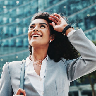 Business woman, thinking and happy in city with commute to job, direction and outdoor to start career. Person, street and smile with low angle, reflection and perspective with inspiration in Colombia; Shutterstock ID 2607311197; purchase_order: M &R; job: Coen; client: ai en cyber campagne