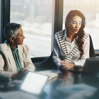 Meeting, collaboration and women with laptop, review and discussion for stats, talking and company. Corporate, teamwork and reading updates for business, accountant and people with tech in boardroom
