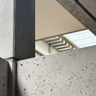 Abstract View of Brutalist Concrete Structure with Staircase and Open Sky