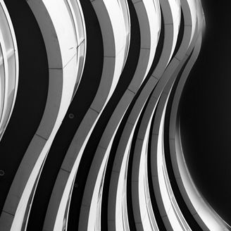 Abstract bottom up architectural view on modern residential building, black and white high contrast, Abu Dhabi
