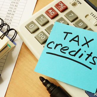 Memo stick with words tax credits.