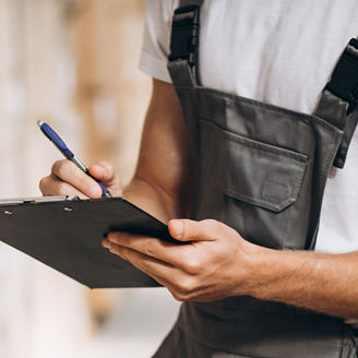Young man working at a warehouse with boxes, Young man working at a warehouse with boxes