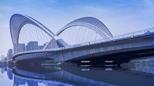 Skyline against a river and a bridge banner
