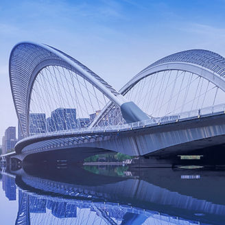 Skyline against a river and a bridge banner