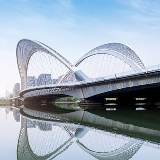 Skyline against a river and a bridge