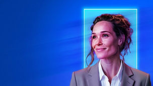 A professional person in a blazer looking to the side, framed by a glowing outline against a blue gradient background.