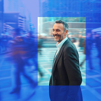 Smiling man in a busy city street