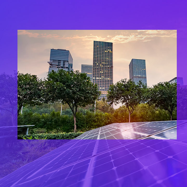 Solar panels with city at sunrise in background banner