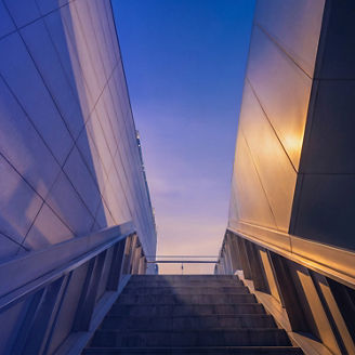 Staircase between buildings in twilight sunlight