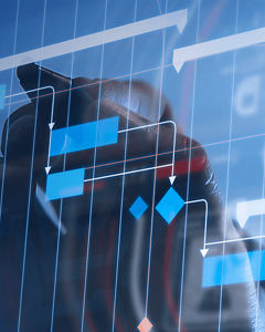 Pen in front of data charts