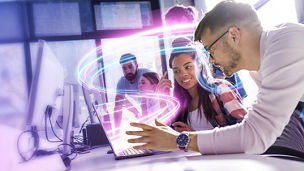 Students using laptop with light beams coming out of it repsenting generative AI