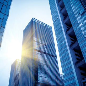 sun shining through buildings