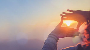 Sun view through hand formation