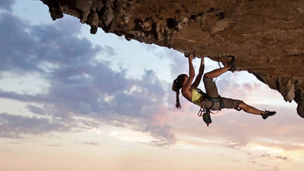 Woman climbing a mountain
