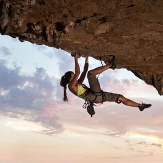 Woman climbing a mountain