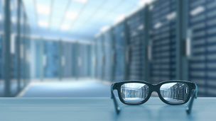 Night cityscape focused in glasses lenses. Vision concept