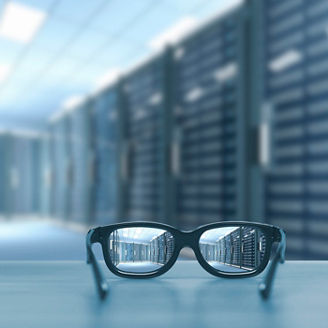 Night cityscape focused in glasses lenses. Vision concept