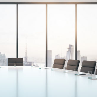 Conference room with table and chairs, large window and city view at sunrise, business concept. 3D Rendering