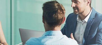 Leader, meeting or business people with banner for planning, investment research or budget advice. Mentorship, laptop and financial advisor in discussion for accounting review, teamwork and report.