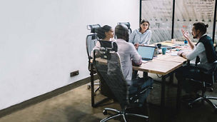 Operation efectiveness team collaborating in boardroom